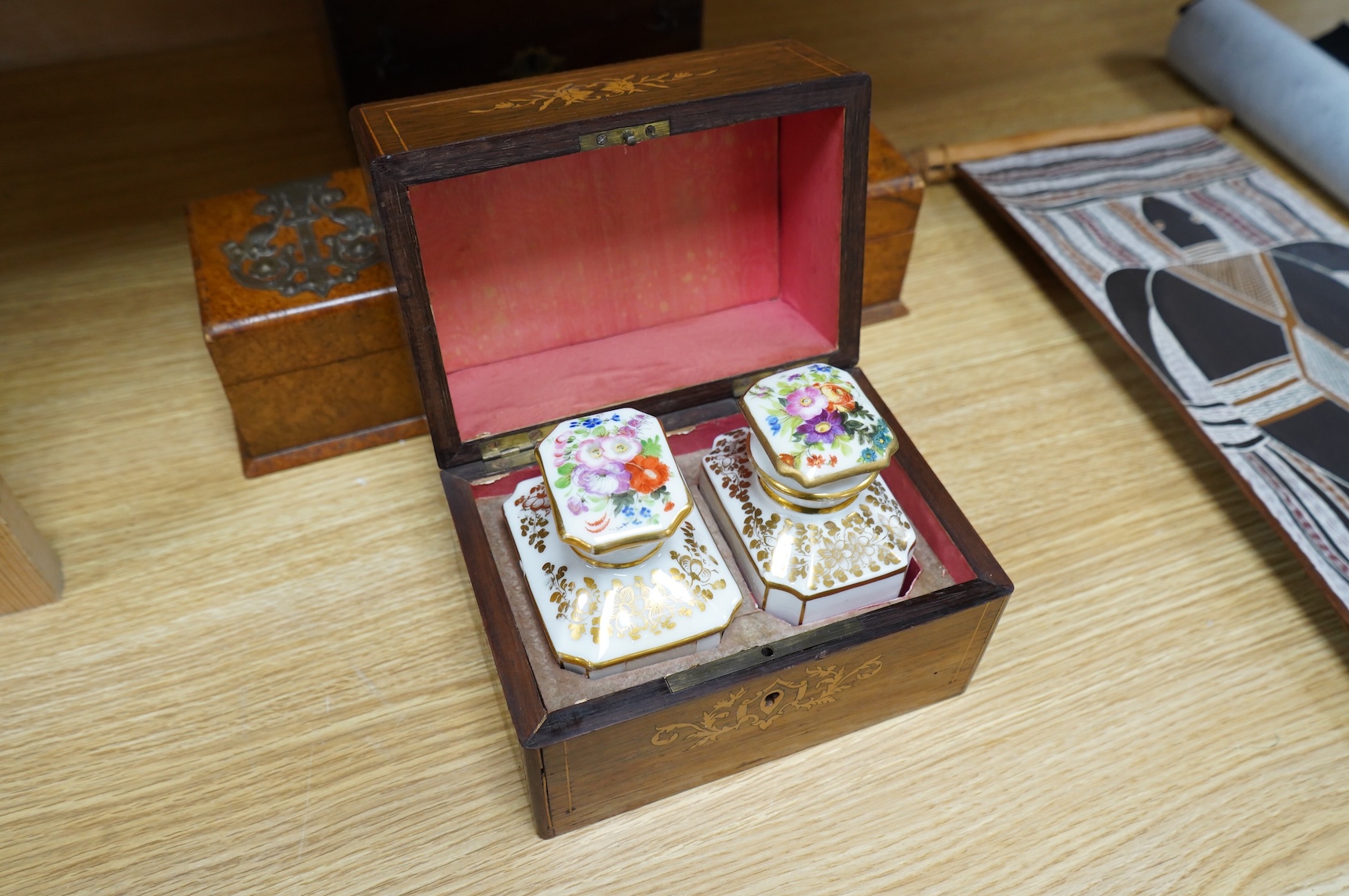 Four boxes to include a burr elm bound example, together with a French inlaid ‘Thé’ caddy with porcelain canisters, largest 32cm wide